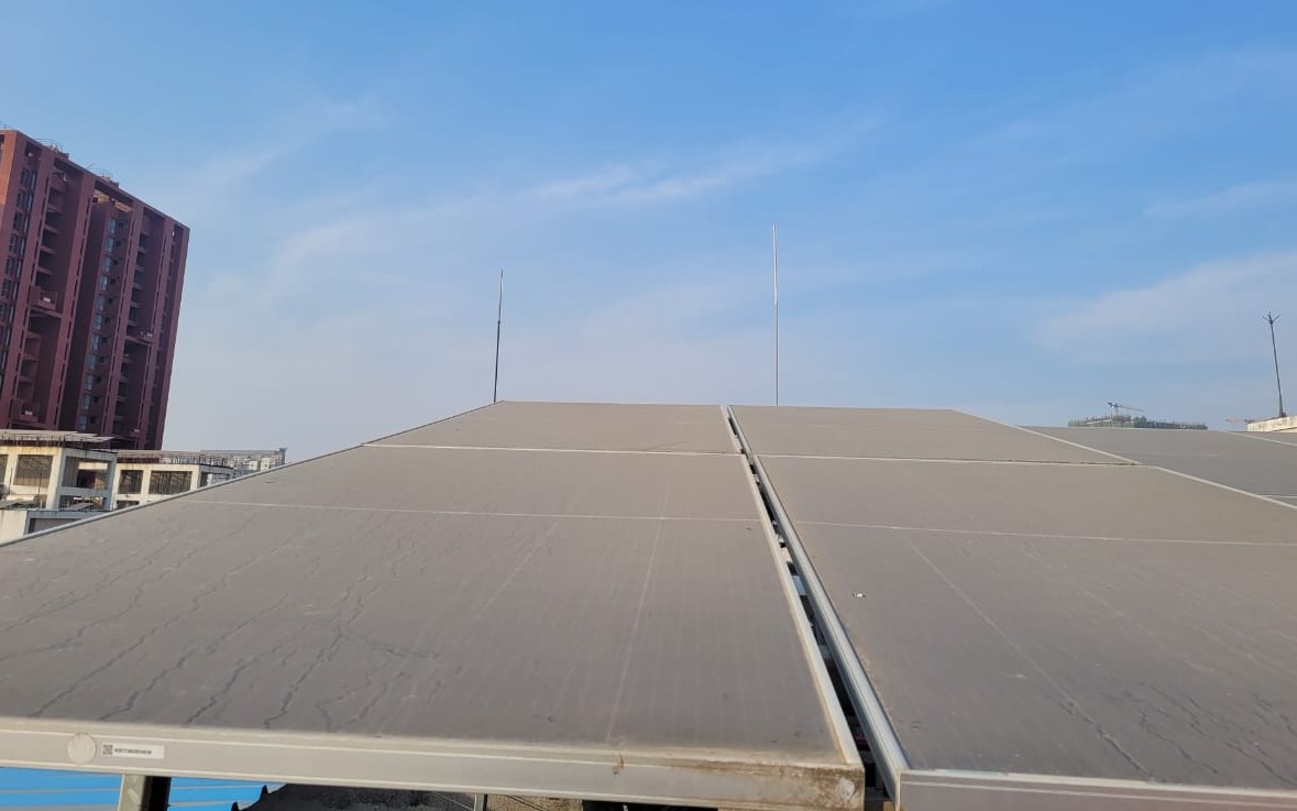 Soiled solar panels losing output on a rooftop array
